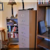 F104. Metal file cabinet.